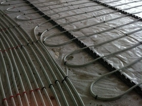 Under floor heating pipes laid out
